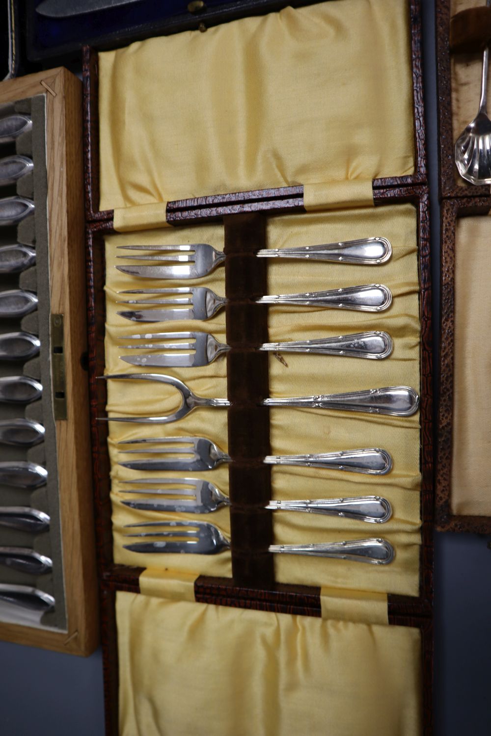 Five cases of plated cutlery.